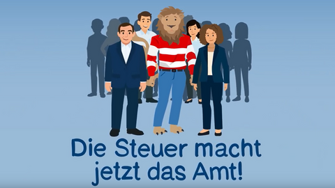 Eine Gruppe von Personen mit dem Hessenlöwen in rot-weiß-gestreiftem Pullover und blauer Hose